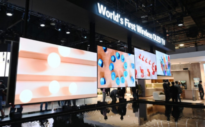 Four LG SIGNATURE OLED M models hanging under the title of World’s First Wireless OLED TV at an exhibition
