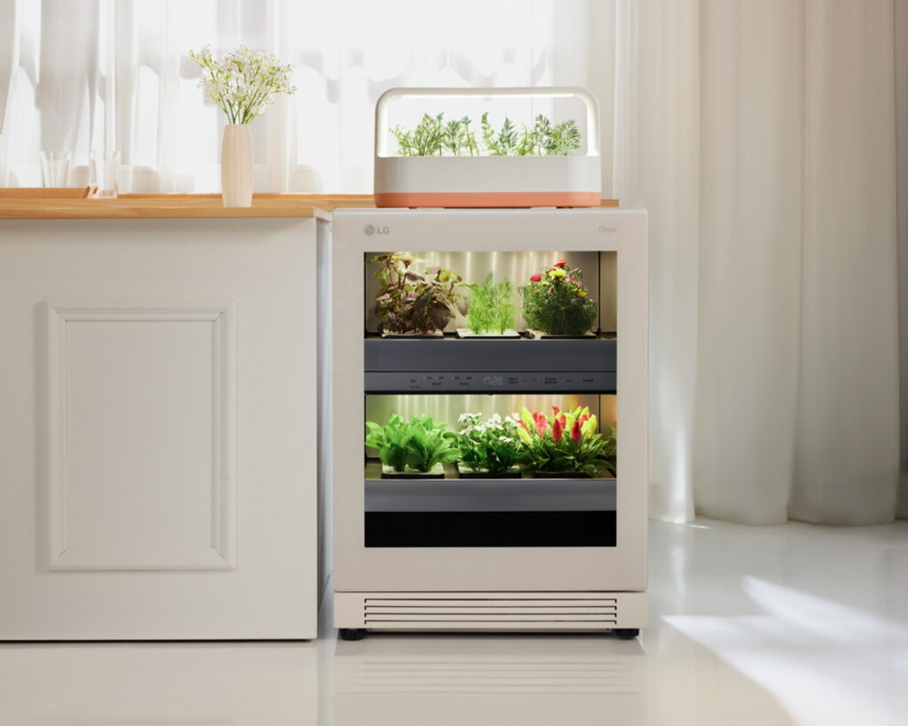 A front view of LG tiiun Nature Beige indoor gardening appliance with tiiun mini on its top