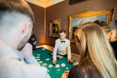 Journalists enjoying a game of blackjack at the casino table with LG SIGNATURE Fun Money