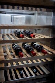 Inside of LG SIGNATURE Wine Cellar filled with a few bottles of wine