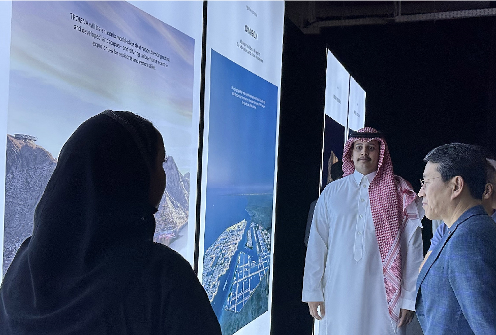 LG CEO Cho taking a look at a sign which explains NEOM City Project