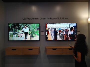 A visitor enjoying a first-hand experience of LG Pro:Centric Direct In-Room Solutions