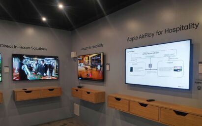 Three displays are showing Direct In-Room Solutions, Amazon for hospitality, and Apple AirPlay for Hospitality