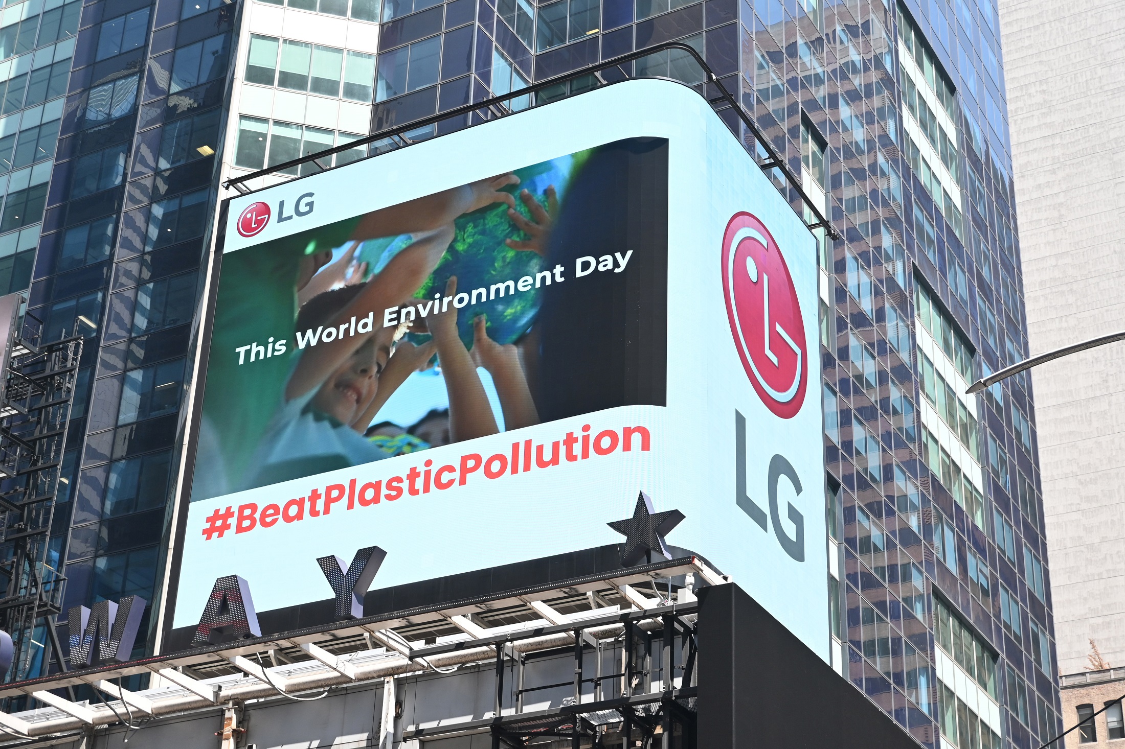 A video highlighting LG's commitment to convert to 100 percent renewable energy displayed on a digital billboard at New York's Times Square