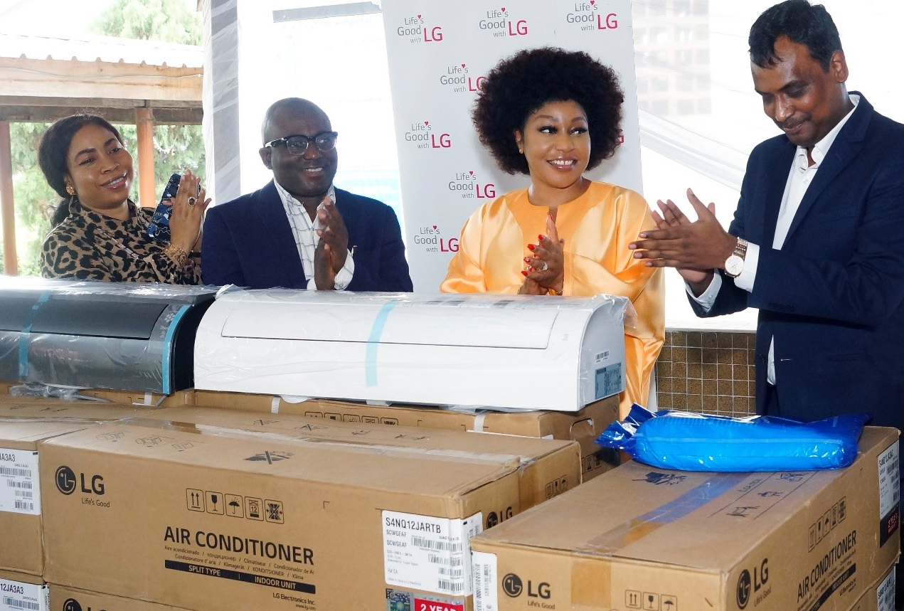 Four people applauding to appreciate LG West Africa's donation of LG DUALCOOL air conditioners