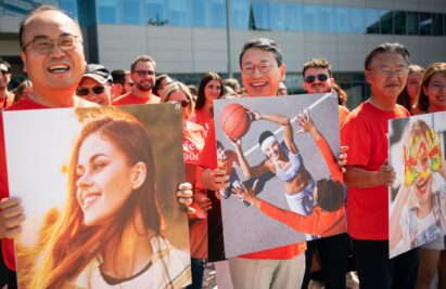 LG CEO Cho and LG Italy employees holding panels which have various lifestlye images