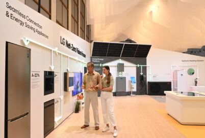 Two people at LG booth prepared for IFA 2023