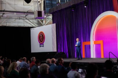 A photo of a LG NOVA event where Sokwoo Rhee is giving a speech