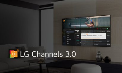 A wall-mounted LG OLED TV showing off the home screen of LG Channels 3.0 in a neatly arranged living room
