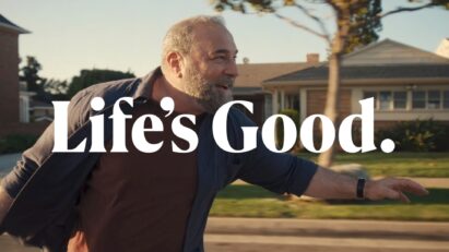 An image of a man riding a longboard with a phrase 