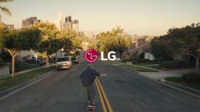 An image of an old man riding a longboard with LG logo at the center