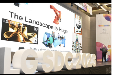 A photo of a man giving a presentation on the podium during Software Developer Conference 2023