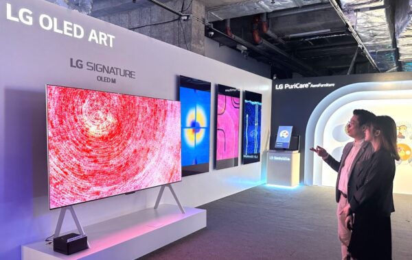 Visitors observe the LG SIGNATURE OLED M3 model displayed as part of the LG OLED Art booth at the Hong Kong Digital Art Fair