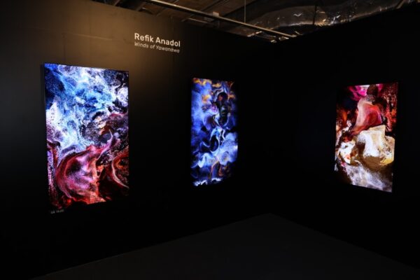 A booth at the Hong Kong Digital Art Fair featuring a digital representation of Refik Anadol's artwork on LG Smart TVs