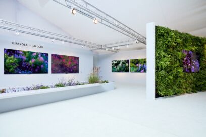 A white showroom full of wall-mounted LG OLED TVs displaying Quayola’s digital art
