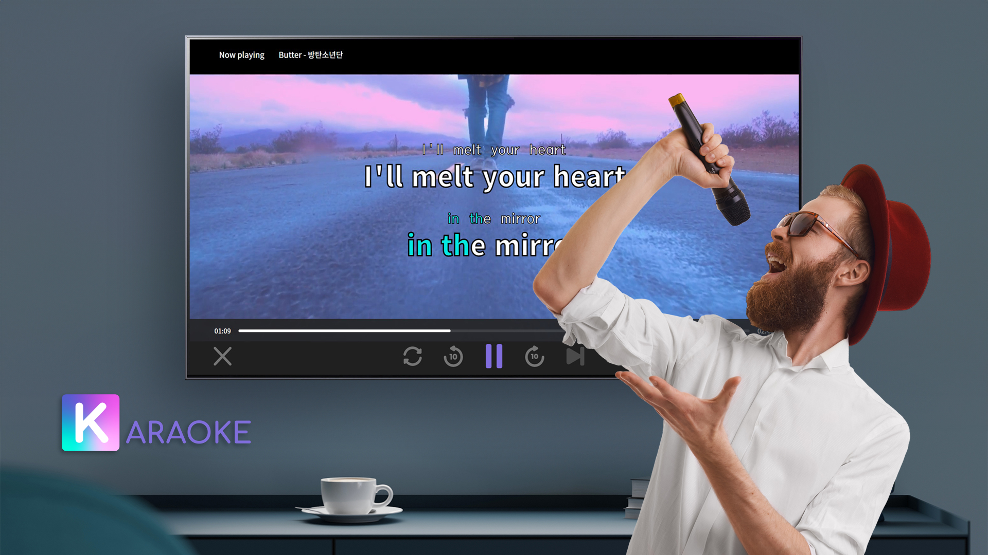 A man singing enthusiastically into a microphone using the K-araoke service on his LG Smart TV.