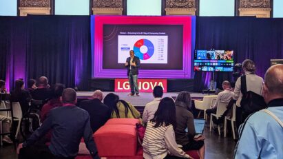 A person giving a speech at LG NOVA Innovation Festival in front of a large crowd