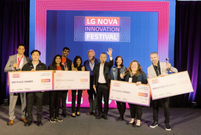 A photo of the winners of the Startup Pitch Competition standing next to each other posing for the camera with their awards