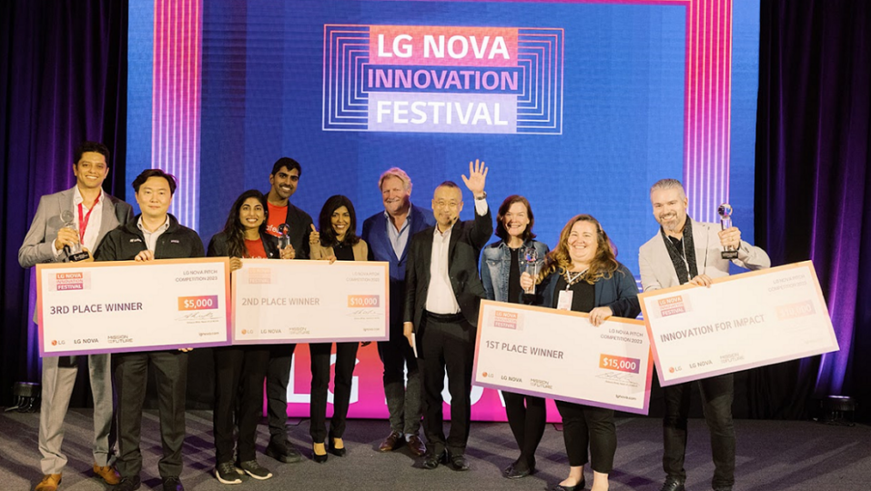 A photo of the winners of the Startup Pitch Competition standing next to each other posing for the camera with their awards
