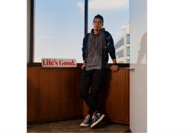 A photo of Choi Joong-ho, professional at LG's Brand Strategy Team, standing next to a table