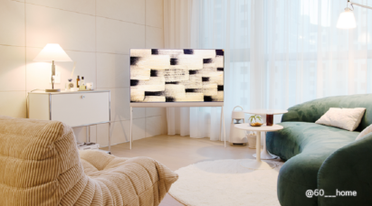 A photo of the LG Objet Collection Pose TV placed between two couches in the living room