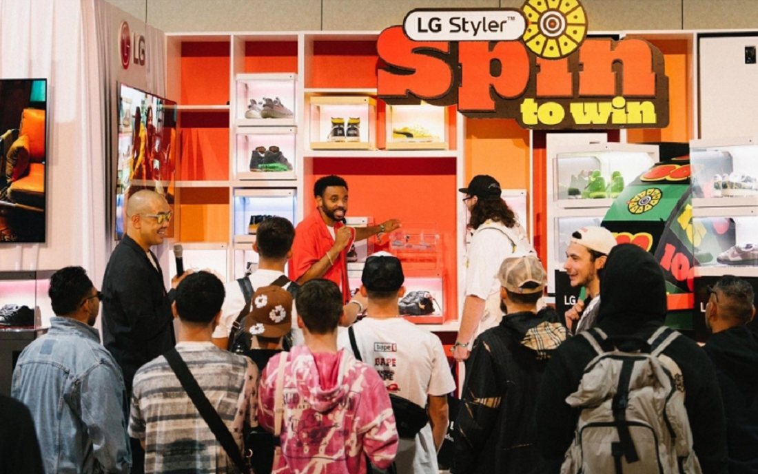 A photo of people gathered around the LG booth