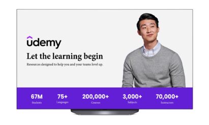 Udemy's home page, which features a man in a gray knit sweater, highlights the 200,000+ courses available in over 75 languages