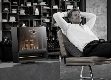 A photo of a man relaxing next to the DukeBox by LG Labs