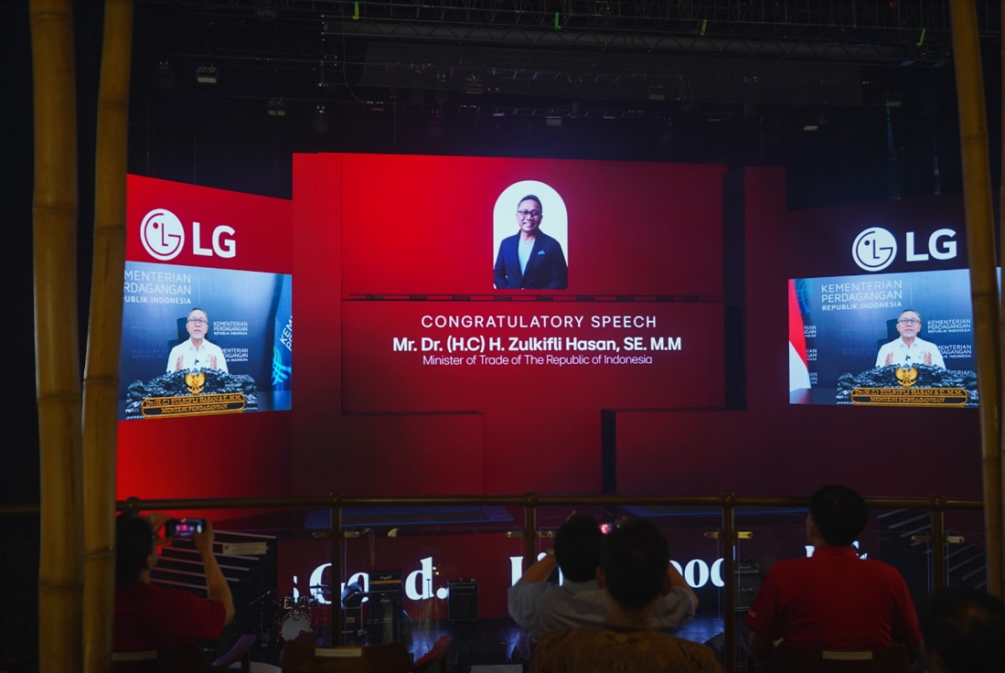 A photo of the stage screen displaying a congratulatory speech from Mr. Dr. H. Zulkifli Hasan, SE. M.M, the Minister of Trade of The Republic of Indonesia