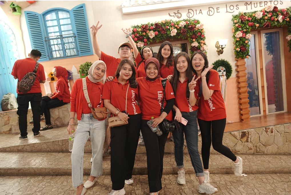 A photo of LG Indonesia's employees posing for the camera with Life's Good logo shirts on