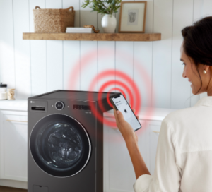 An image of a woman standing with her phone in front of the LG WashCombo with a ringing illustration coming from the phone