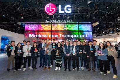 A photo of people standing together for a picture infront of the LG booth