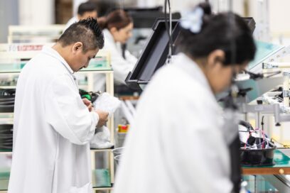 Multiple workers engaged in tasks at the factory