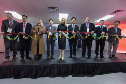 Officials participating in a ribbon-cutting ceremony