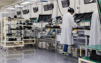 Workers and the interior view of the factory