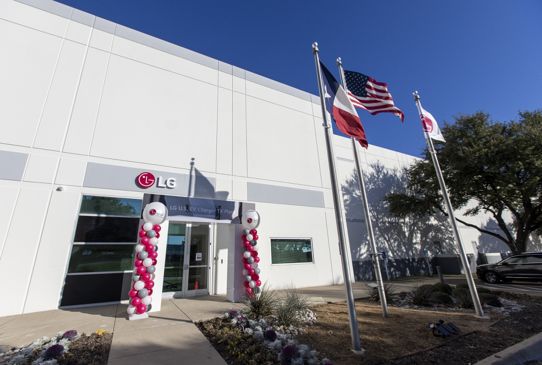 An image of three flags standing at the factory site