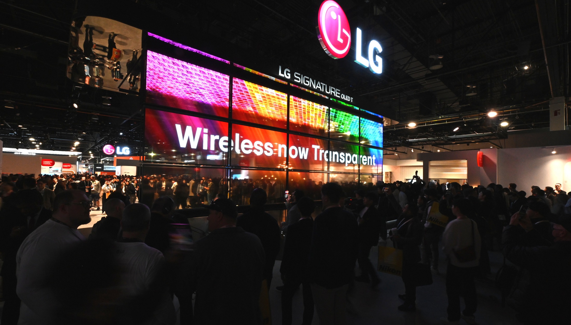 A photo of LG's booth at CES 2024 with the OLED T display
