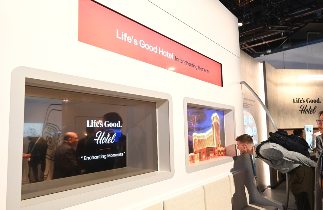 A photo of a person looking at the Life's Good Hotel display demonstration