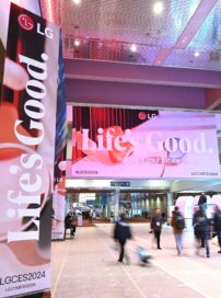 People walking by the Life's Good sign at CES 2024