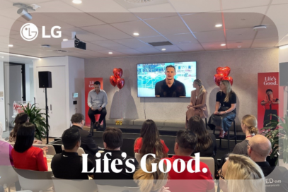 An image of people gathered around talking and listening with a frame around the iamge with the LG logo