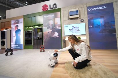 A photo of a women demonstrating the LG Smart Home AI Agent in the Zero Labor Home zone at KBIS 2024