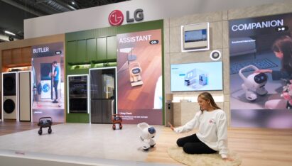 A photo of a women demonstrating the LG Smart Home AI Agent in the Zero Labor Home zone at KBIS 2024