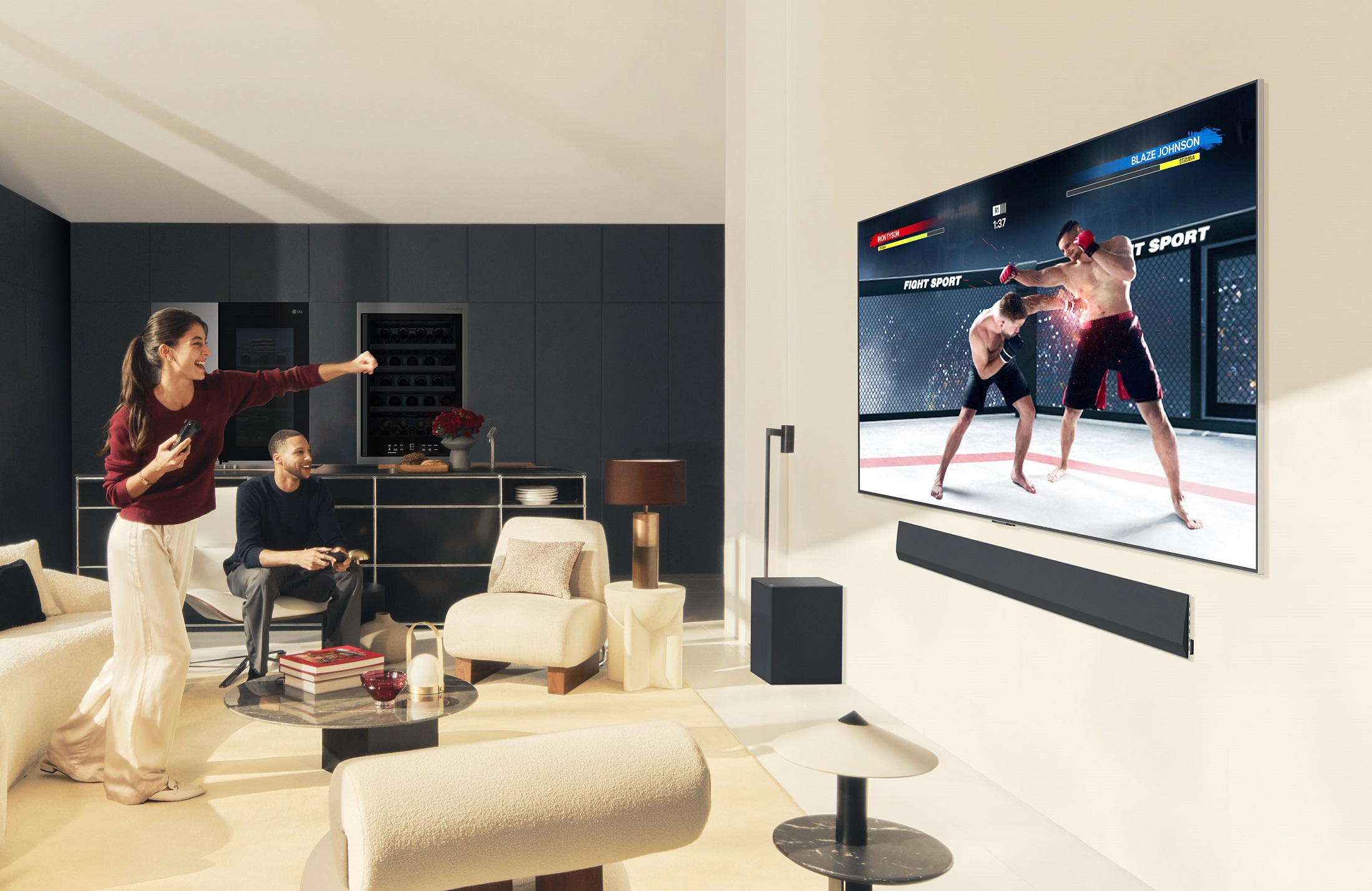 A photo of a woman imitating the image on the television and a man sitting next to her watching