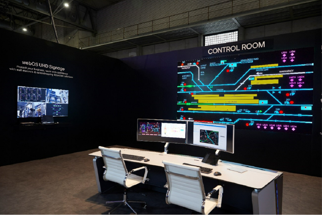 A photo of the control room with screens and desks