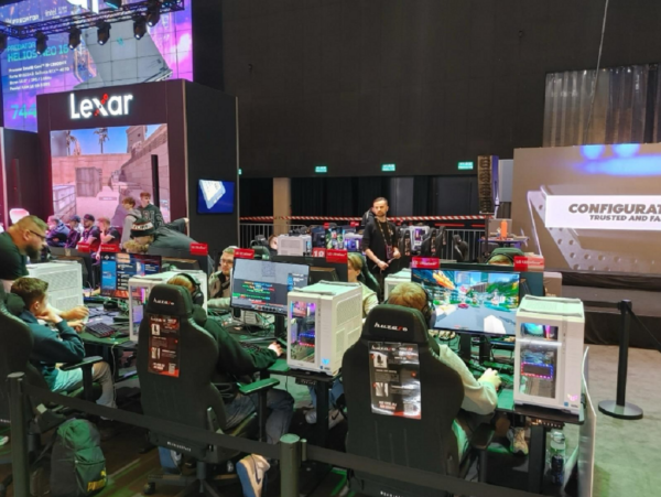 A picture of people gaming gathered around the venue area