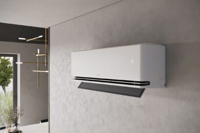 A photo of the LG DUALCOOL air conditioner set up by a wall