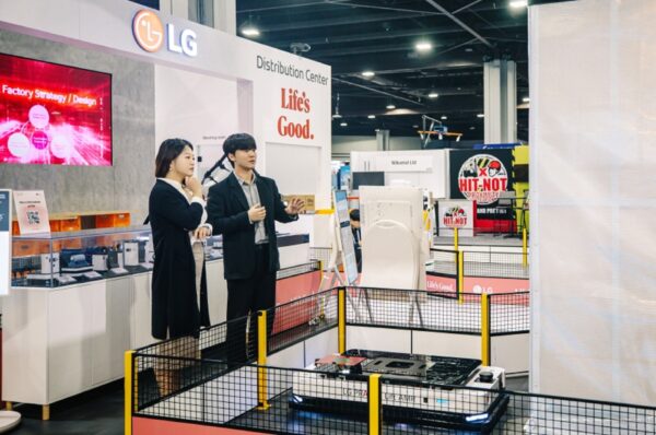 A picture of a man and a woman at the LG Booth at the Distribution Center