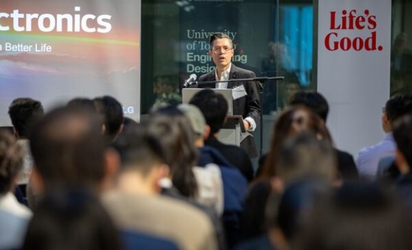 A picture of senior director and head of the LG Toronto AI lab, Kevin Ferreira talking on the podium