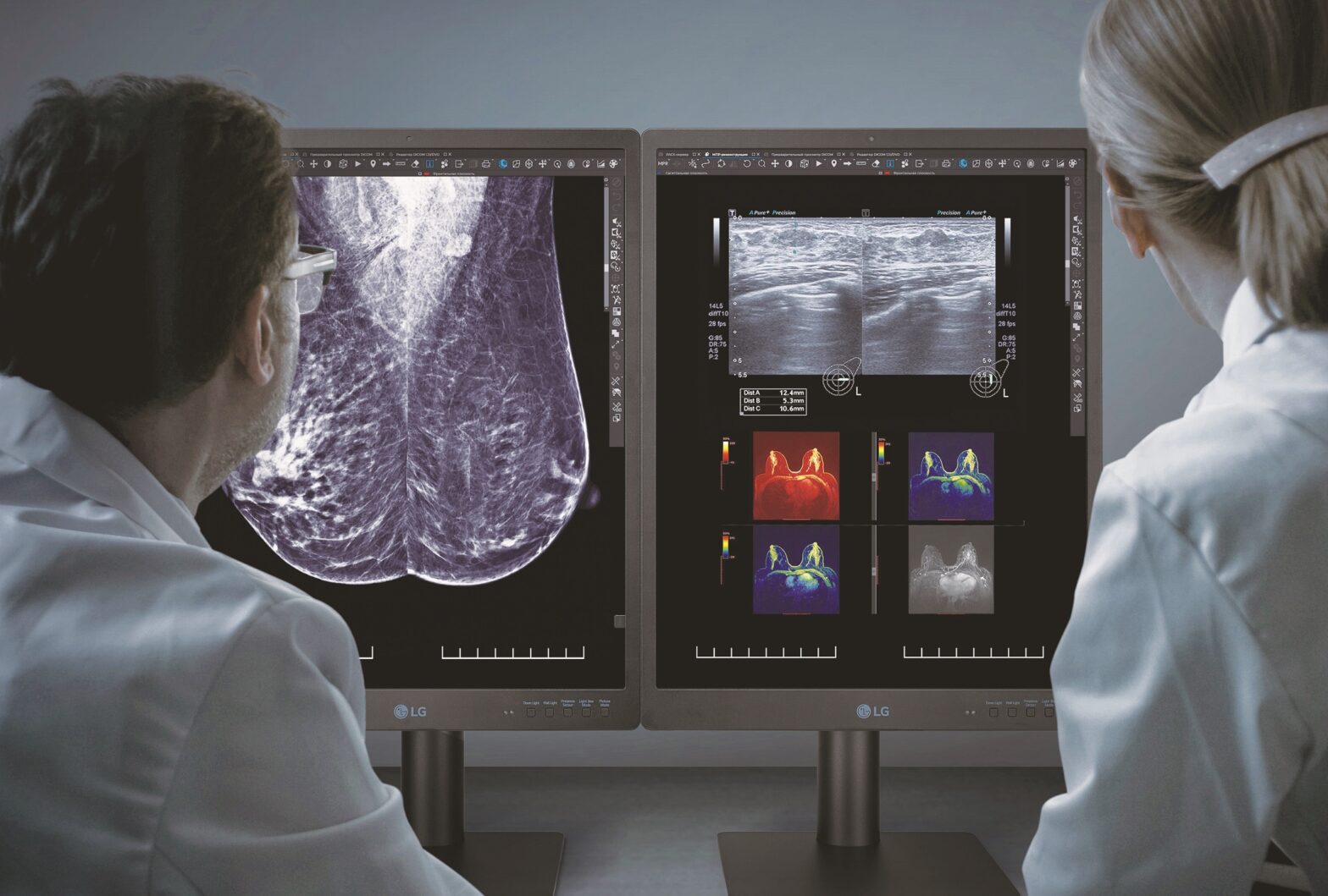 Two doctors looking at images displayed on LG’s diagnostic monitor
