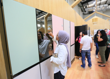 An image of woman looking at the LG InstaView™ French Door refrigerator